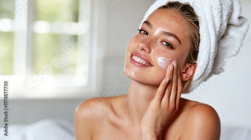 Woman Applying Skincare Product in Bright Room After Shower
