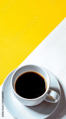 Coffee Cup on a White Plate With a Yellow Background Showing a Simple Breakfa...