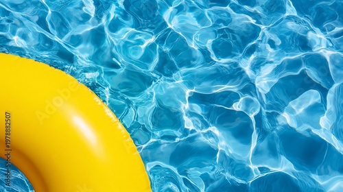 Yellow Float in Clear Blue Water on a Sunny Day Near a Poolside Area