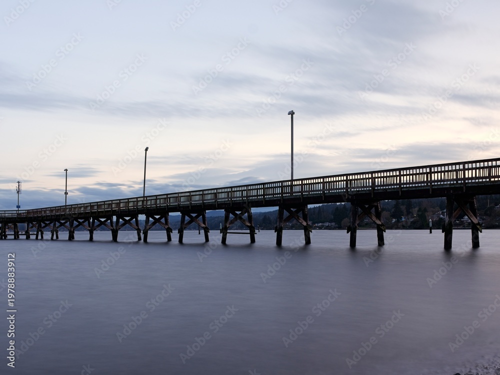 Fototapeta premium Long pier at sunset in Washington.