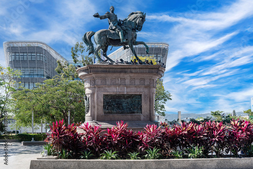 Gerardo Barrios monument in downtown San Salvador with modern architecture