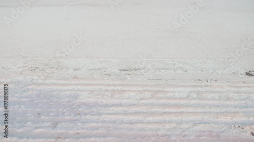 4K Landscape shot of white Rann of Kutch due to the salt deposits as seen in White desert of Kutch in Gujarat, India. Scenic view of white land of Kutch during the winter season.