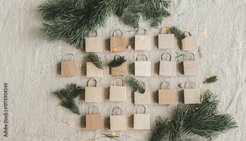 Minimalist Nordic advent calendar with wooden bags and pine branches