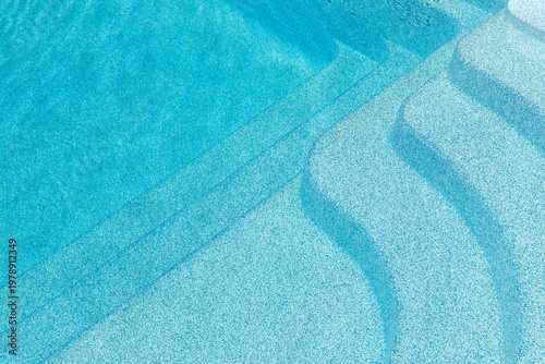 Vászonkép New modern fiberglass plastic swimming pool entrance step with clean fresh refreshing blue water on bright hot summer day at yard or resort hotel spa area
