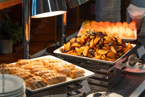 Wallpaper Mural Hot buffet station with roasted potatoes and mushrooms Torontodigital.ca
