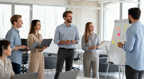 Young business people communicating effectively during an internal workshop session.