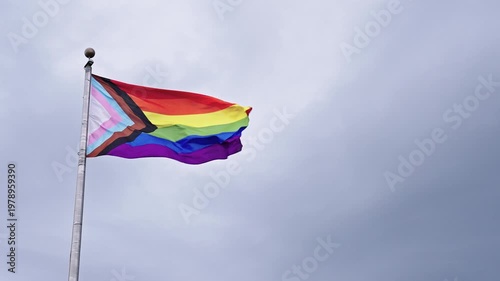 LGBT community. Tolerance and equality. World gay pride. Rainbow gay flag. Pride month. LGBTQ rainbow flag. LGBT rainbow flag waving against sky. Symbol of pride and LGBTQ. Colorful pride flag
