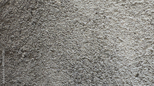 Rough concrete wall texture with plaster detail, abstract industrial background.