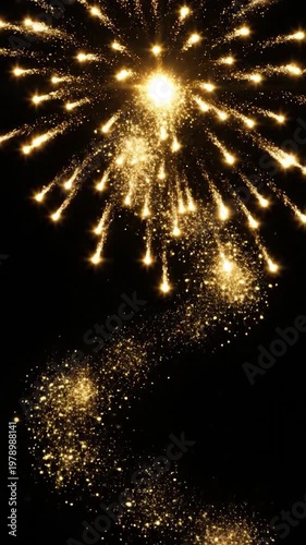 A bright golden trail of shimmering light particles flows elegantly against a deep black background