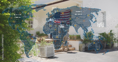Family standing on tiled steps at house, parent wearing camo holding American flag with map overlay