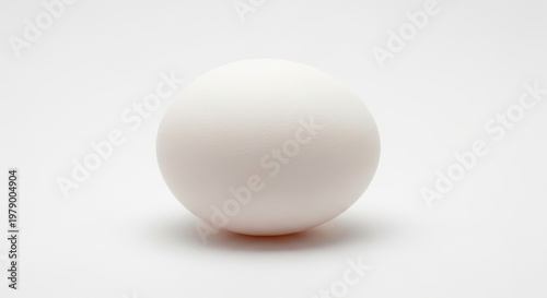 Soft pink puffball resting on a light background