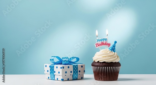Birthday celebration with cupcake and gift on table