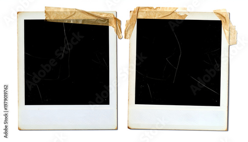 Two vintage Polaroid photographs, each with a cracked black surface and secured with aged brown tape, evoke a sense of nostalgia and forgotten memories.
