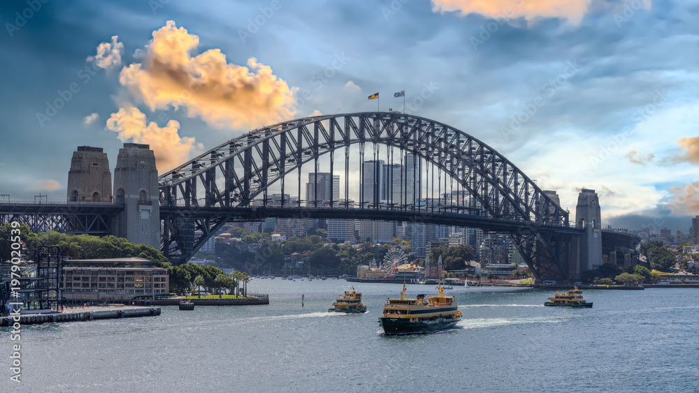 Obraz premium 10 April 2026 view of Sydney Harbour and Circular Quay on a Beautiful Autumn Afternoon lovely colours of the sky in Sydney NSW Australia
