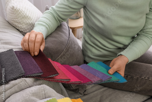 Woman with fabric samples s...