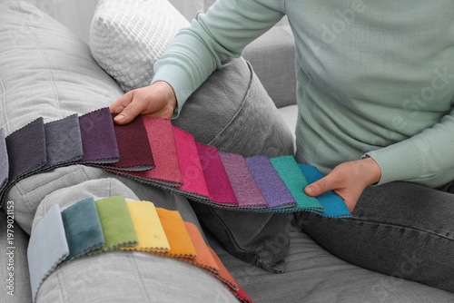 Woman with fabric samples s...