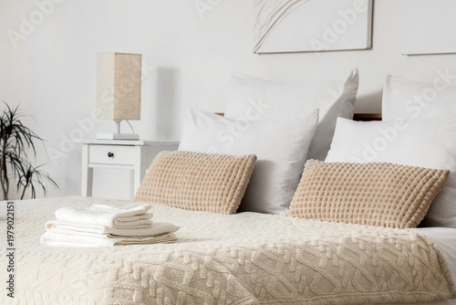 Big bed with stylish linen ...