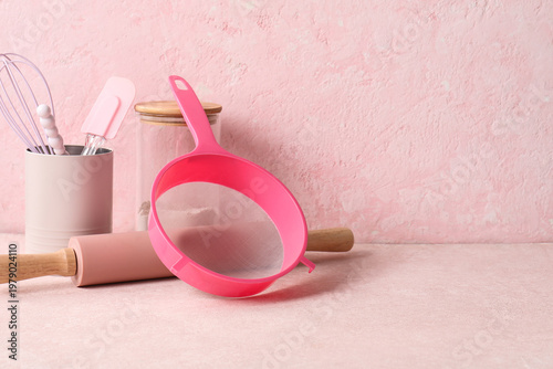 Sieve with rolling pin, jar...