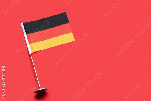Flag of Germany on red back...