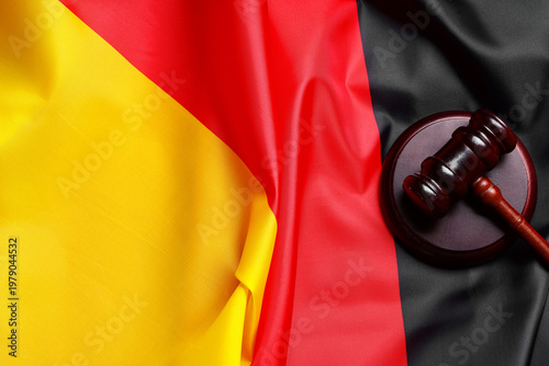 Judge's gavel on flag of Ge...