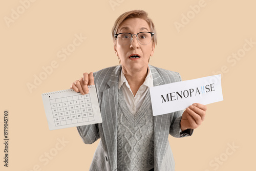Shocked mature businesswoma...