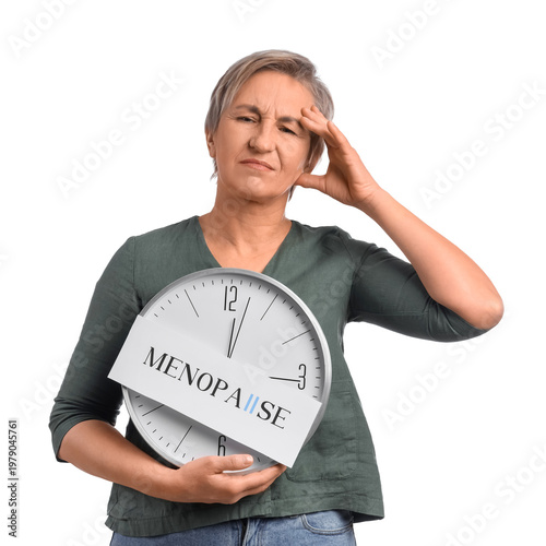 Mature woman holding clock ...