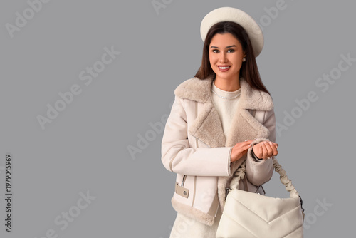 Stylish young woman in whit...