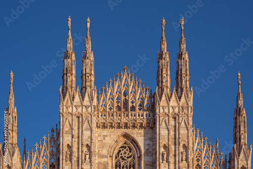upper part of the Duomo Basilica facade, Milano Italy