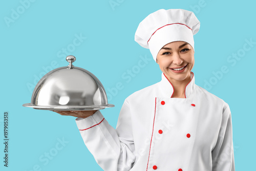 Female chef with cloche on ...