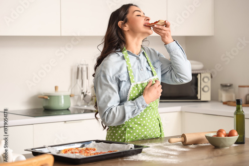 Beautiful woman eating tast...