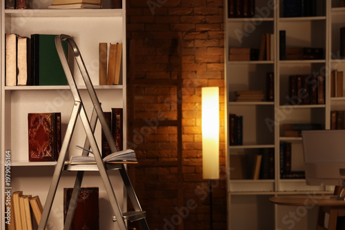 Stepladder near bookshelf i...