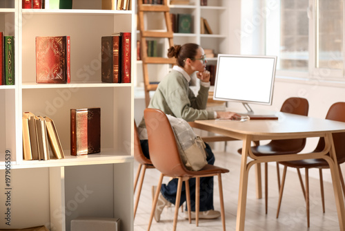 Bookshelf against female st...