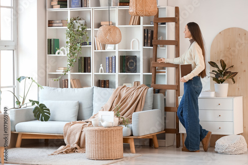 Young woman with book near ...