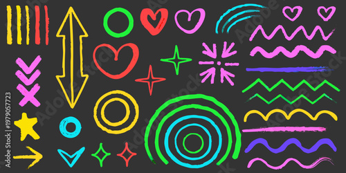 Colorful chalk doodles and shapes scattered on a dark background