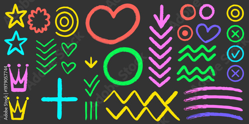 Colorful chalk doodles and shapes scattered across a dark background