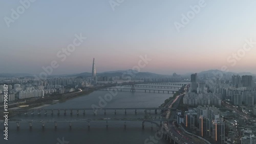 Aerial night view of the illuminated Seoul skyline and Han River from Gwangjin-gu, South Korea.