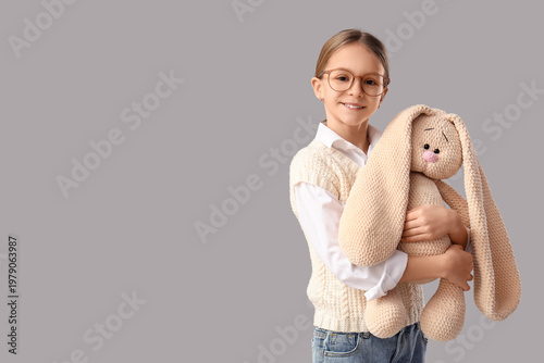 Cute girl hugging toy bunny...