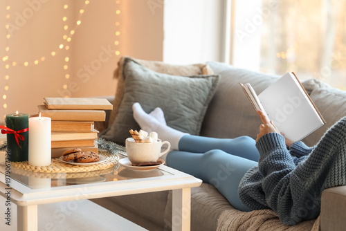 Woman with cocoa and cookie...