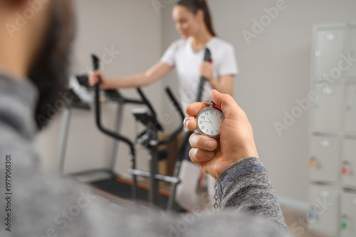 Man with stopwatch against ...