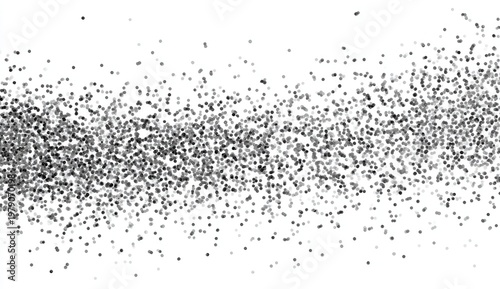 Monochrome image of small dark speckles scattered across a white background