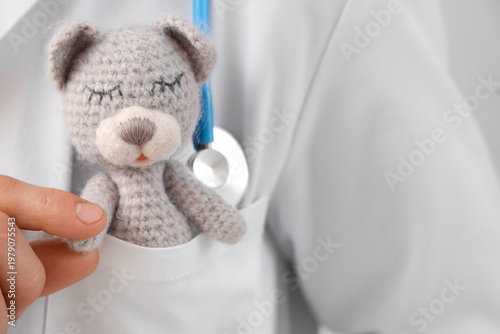 Male pediatrician with toy ...
