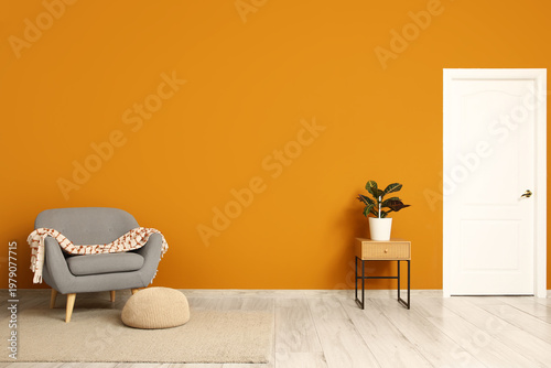 Armchair with pouf and tabl...