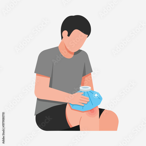 Man sitting on ground applying cold compress to injured knee