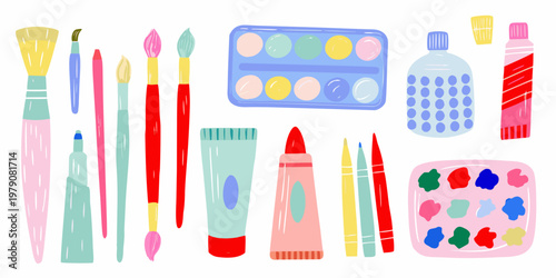Colorful art supplies including paintbrushes watercolors and tubes arranged together