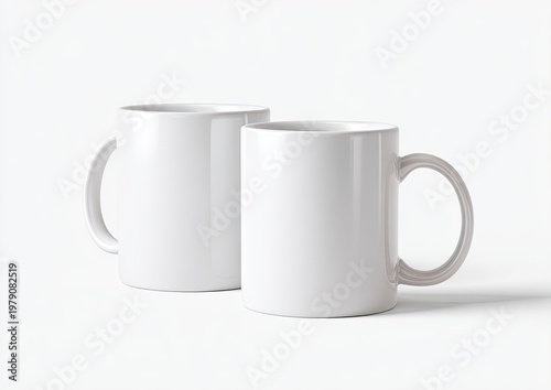 Two plain white ceramic mugs with handles, studio shot