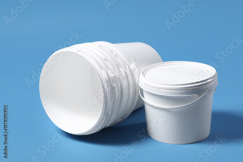 White plastic paint buckets...