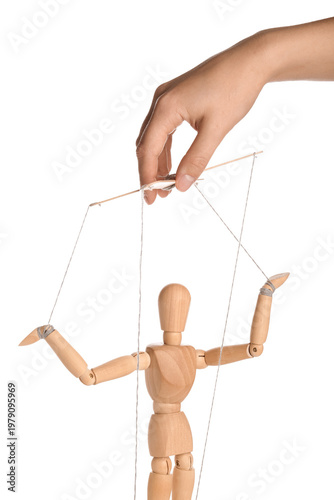 Foto Hand of puppeteer manipulating marionette on white background
