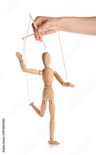 Photography Hand of puppeteer manipulating marionette on white background