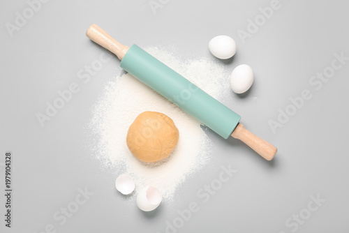 Green rolling pin with raw ...