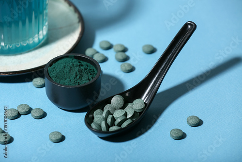 Bowl of spirulina powder wi...